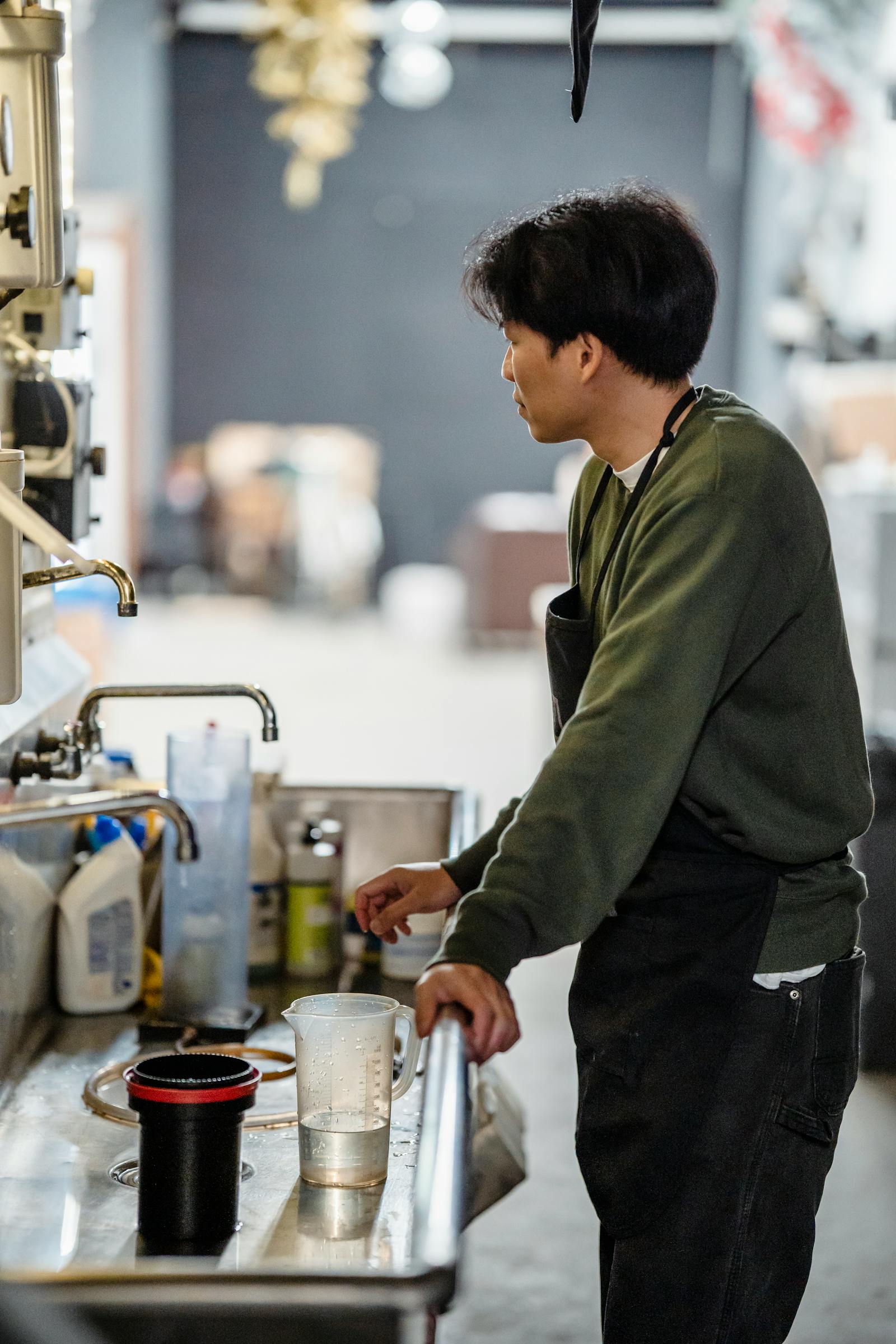 Worker checking water flow at a bathroom fixture